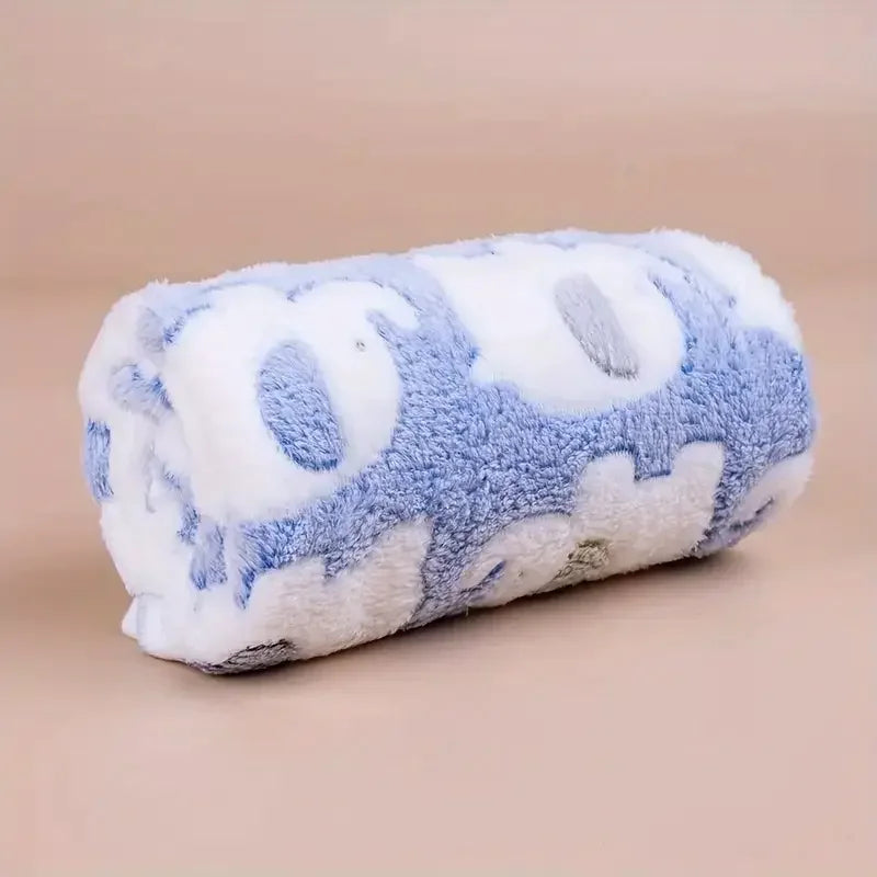 A fluffy blue and white elephant flannel pet blanket for dogs and cats.