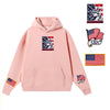 Pink hoodie featuring embroidered USA flag patches and patriotic graphics