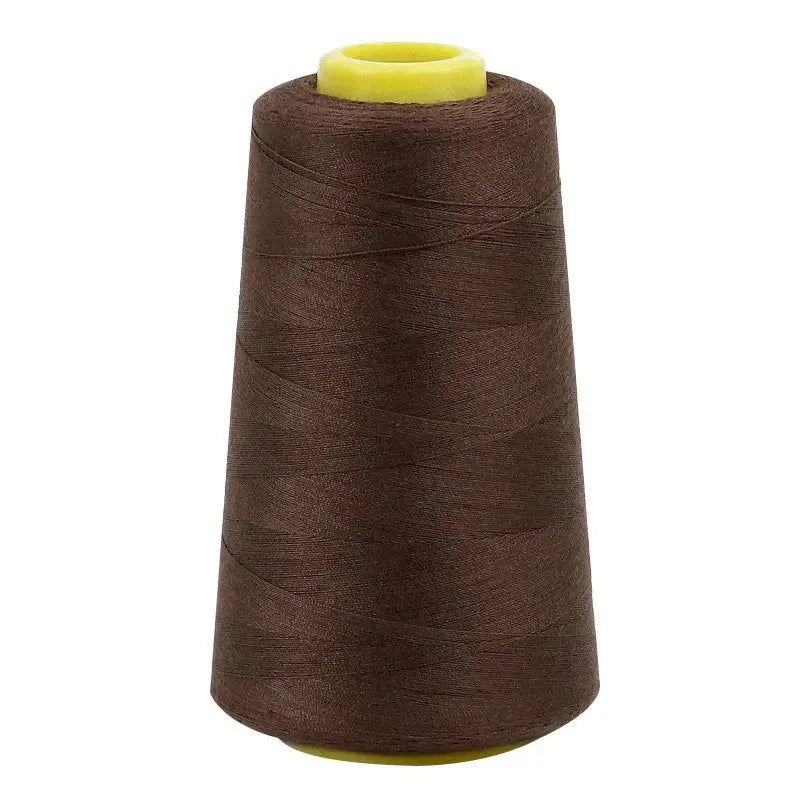 A brown spool of premium sewing thread with a yellow core.