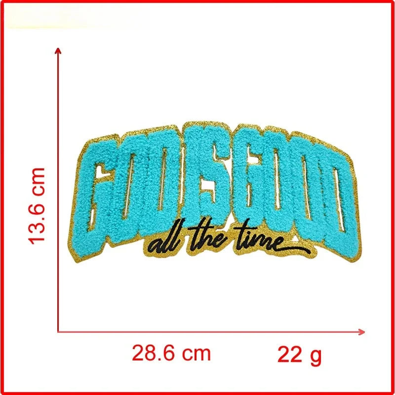 A turquoise and gold embroidered patch with the text GOOD GOOD all the time on a white background.