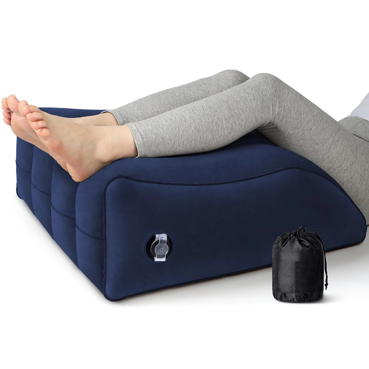 A dark blue inflatable leg elevation wedge pillow is shown supporting a person's legs for pain relief.