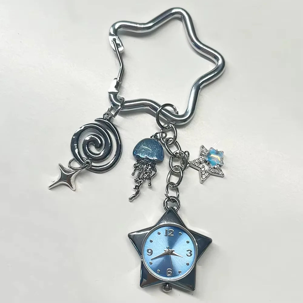Silver star pocket watch keychain featuring a spiral charm and a blue-tinted clock face.