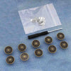 A collection of silver metal button pins is displayed on a translucent white background.
