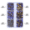 A clear plastic container holding various sizes of glass rhinestones in gold, purple, and blue colors.