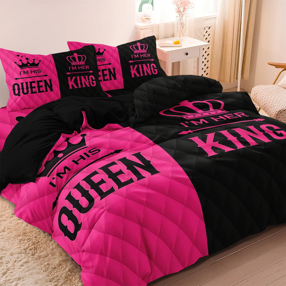 A couple duvet set featuring pink and black crown print microfiber bedding.