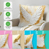 Decorative throw pillow cover featuring golden and white wing patterns on a light fabric.