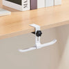 A white adjustable aluminum alloy desk hook with dual clips mounted on a wooden shelf.