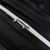 Close-up of a black satin bedding set featuring a silver zipper detail.