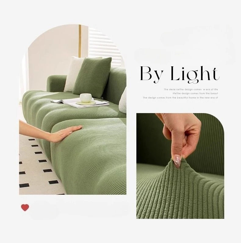 A close-up of a sage green stretchable elastic sofa cover showing the textured fabric and anti-slip design.