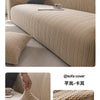 A beige knitted sofa slipcover featuring a textured weave on a modern sofa.