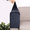 Dark navy velvet sofa armrest covers being held by a hand, resting on a light colored sofa.