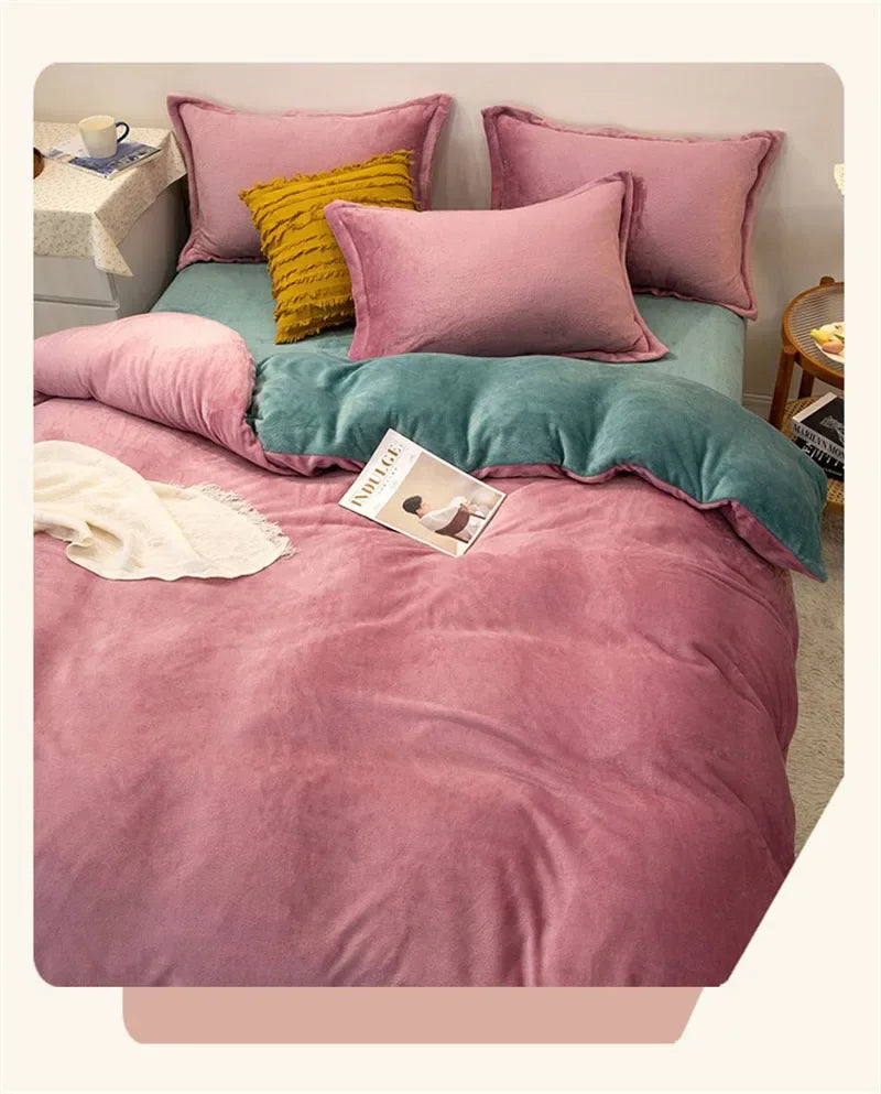 A pink and teal duvet cover set featuring various sized pillows and a fluffy pink blanket on a bed.