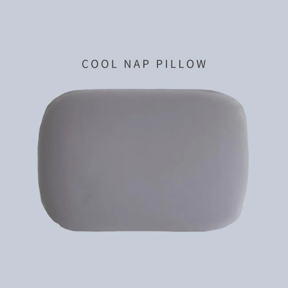 A smooth, rectangular gray memory foam neck and travel pillow.
