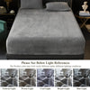 A gray luxury velvet bedding set featuring a sheet and pillow, shown on a bed.