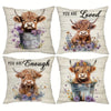 Decorative pillow cover featuring a print of a Highland cow looking directly at the viewer.