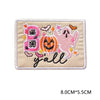 Pink and orange embroidered patch featuring the letter B, a pumpkin, and the word 'yall'