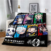 A black throw blanket featuring various Jujutsu Kaisen anime characters and text on the front.