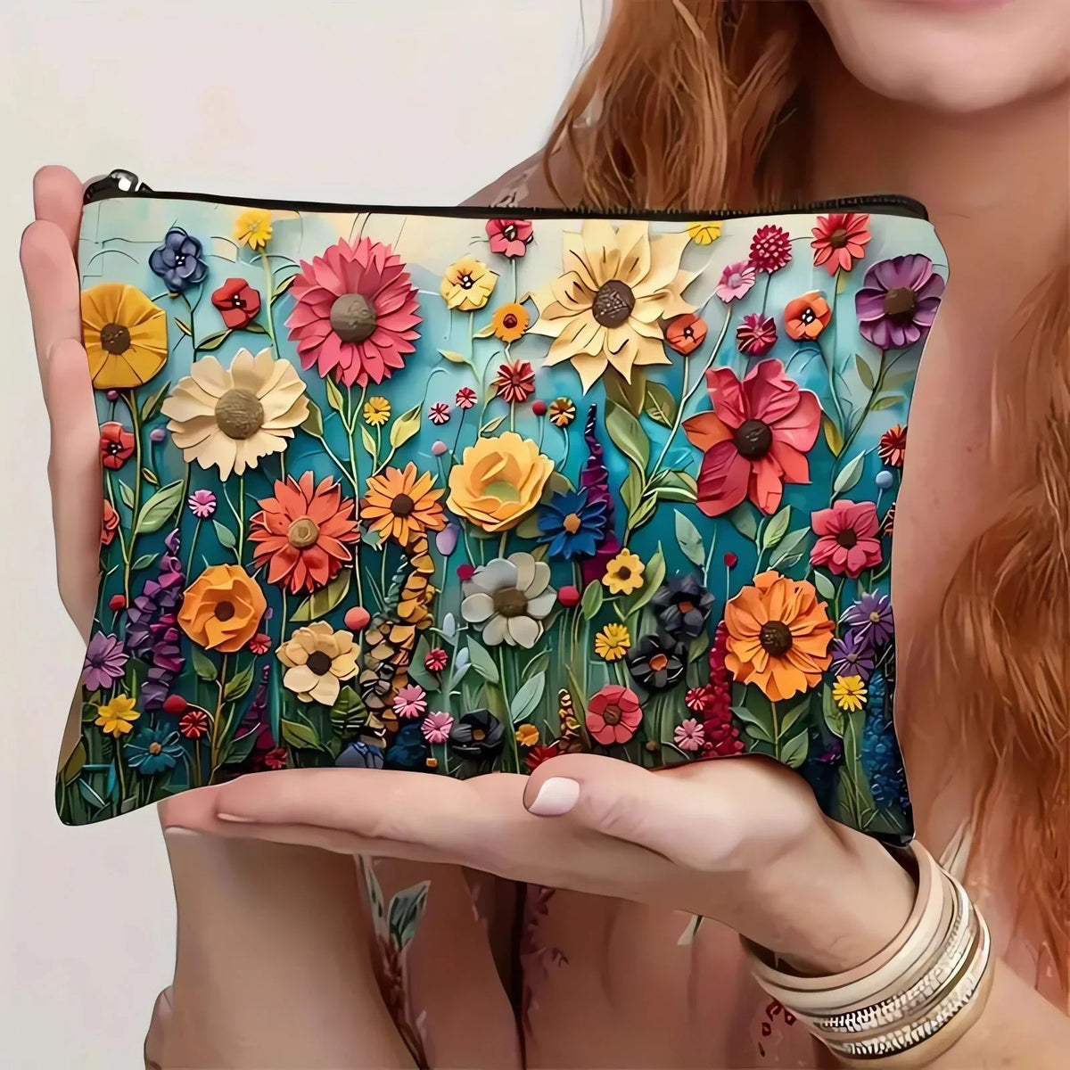 A floral canvas cosmetic bag with a zipper closure featuring colorful flowers and leaves.