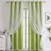 Light green double-layer decorative curtains hanging on a rod in a bright room.