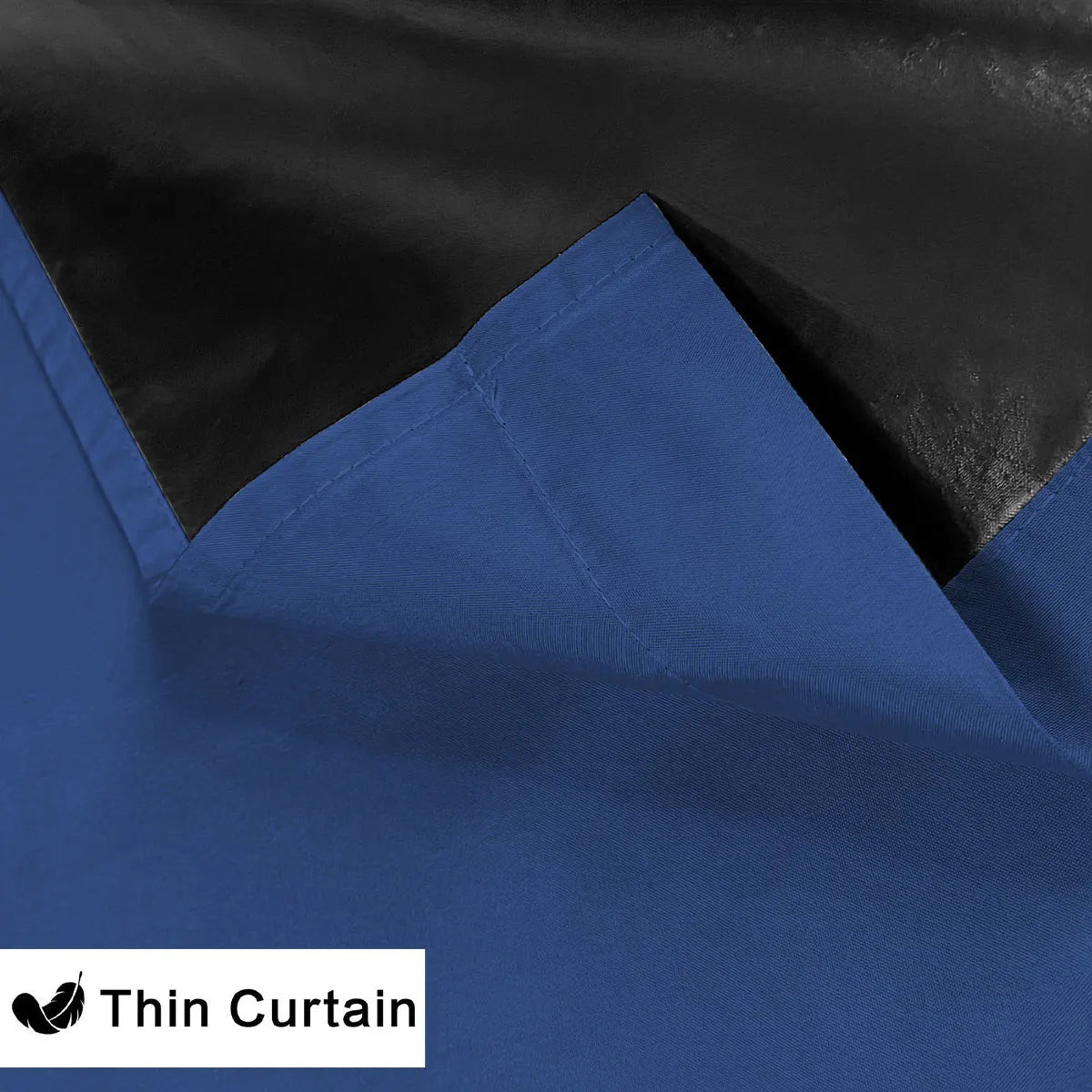 Two panels of royal blue blackout curtains with a black lining shown in a close-up view.
