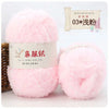 Two pink fluffy yarn balls labeled as Hand Made Soft Coral Velvet Yarn for crafting