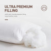 A white pillow filled with ultra premium polyester stuffing, emphasizing soft and skin-friendly filling for healthier sleep.