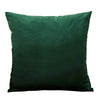 A dark emerald green velvet throw pillow cover.