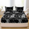 Black and white marble print fitted sheet set with pillowcases on a bed