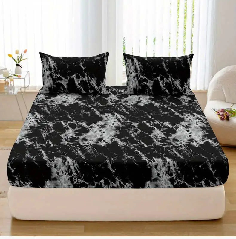 Black and white marble print fitted sheet set with pillowcases on a bed