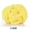 A ball of bright yellow hand-woven chunky chenille yarn.