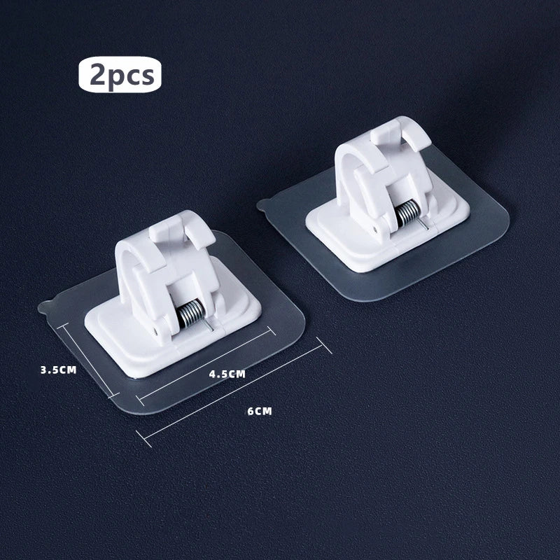 Two white nail-free adjustable curtain rod hooks are shown on a dark surface with dimension lines.