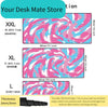 A set of large art vortex mouse pads in various sizes XXL, XL, and L with pink and blue swirling patterns.