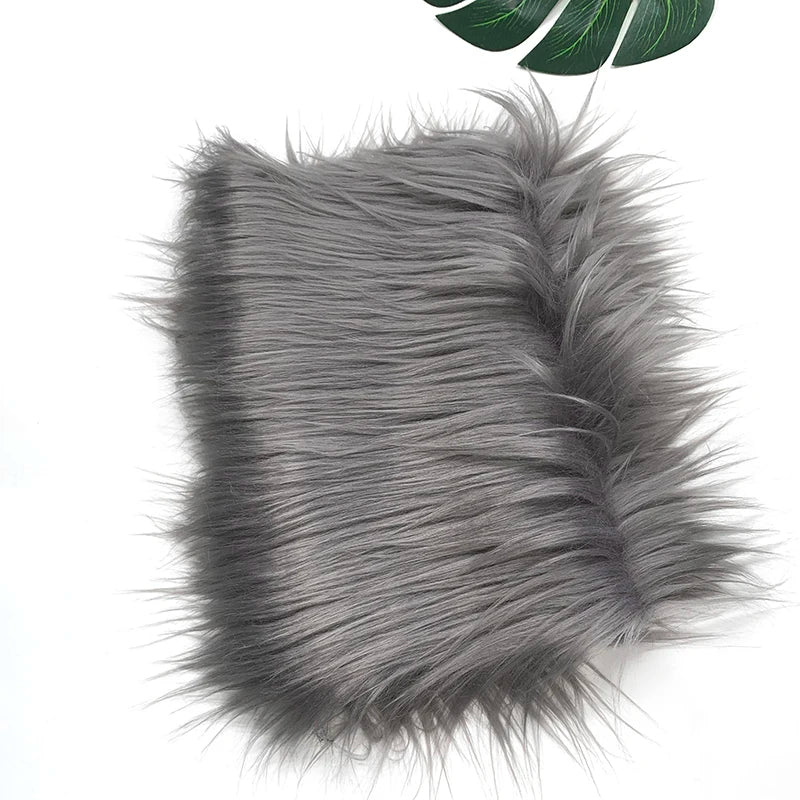 Gray faux fur plush fabric used for sewing and crafting