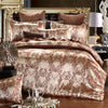 A luxury duvet cover set featuring a beige and brown damask pattern on a bed with dark accents.