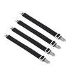 A set of black adjustable crisscross bed sheet clips for secure holding.