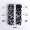 A collection of amethyst glass rhinestones in various sizes and colors packaged in clear plastic compartments.