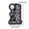 Black embroidery patch with white outline showing a stick figure and the text AROUND & FIND OUT