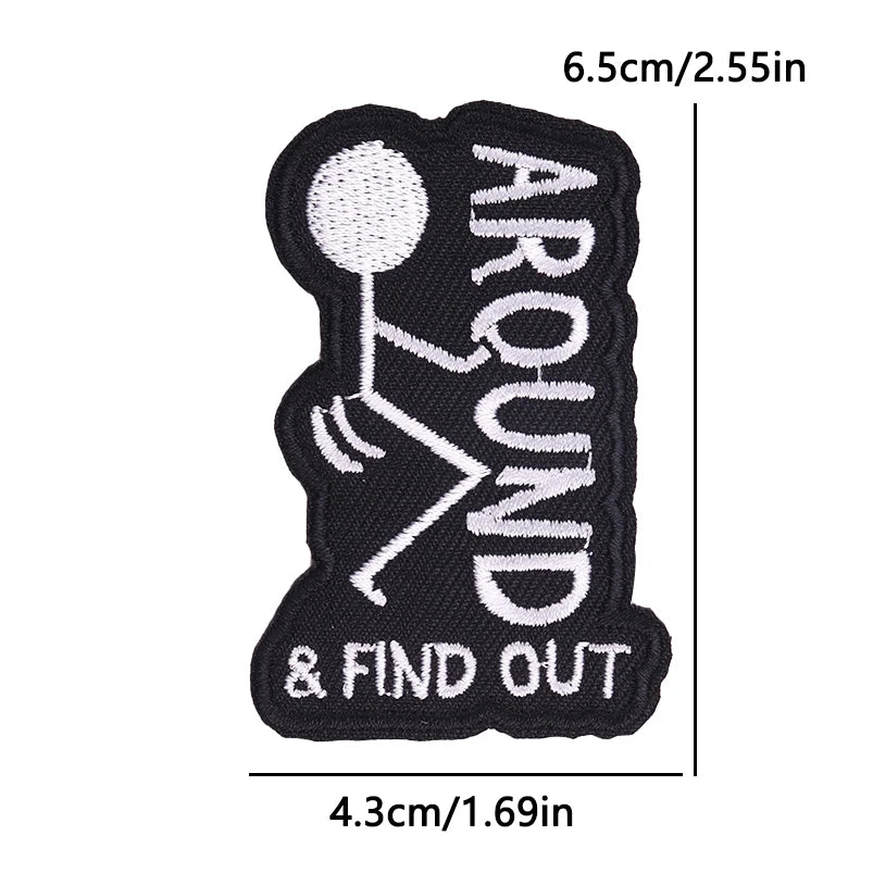 Black embroidery patch with white outline showing a stick figure and the text AROUND & FIND OUT