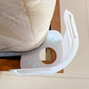 White invisible corner tightener clips used to secure a mattress or sofa.