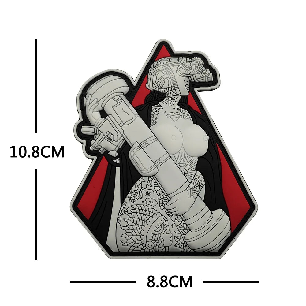 A black and white sticker featuring a woman with a skull design and a large weapon, shaped like an arrowhead.