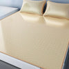 A set of three beige cooling ice silk sheets displayed on a white surface.