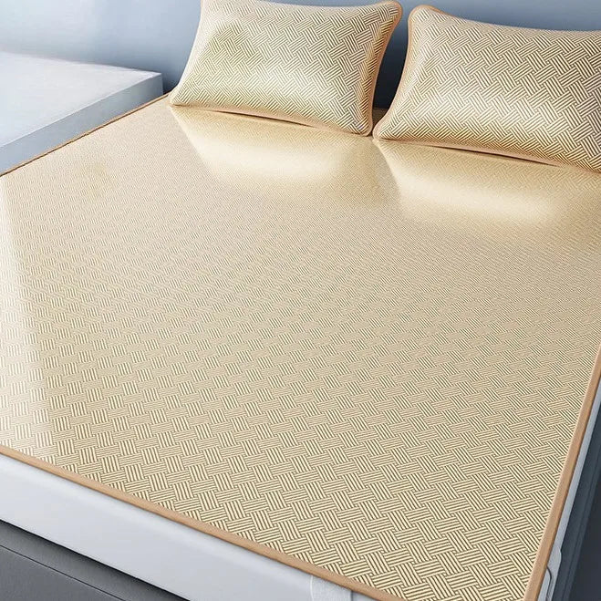 A set of three beige cooling ice silk sheets displayed on a white surface.