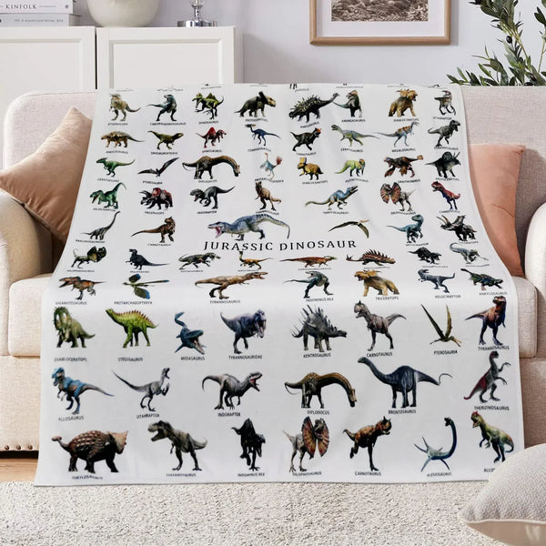A white flannel throw blanket featuring a pattern of various Jurassic dinosaurs.