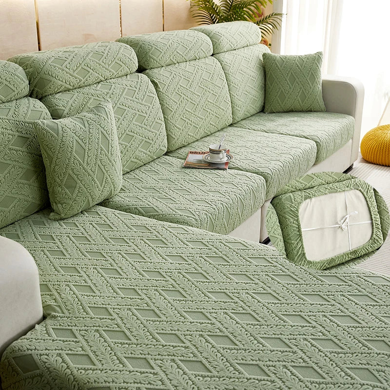 A light green jacquard plush sofa cushion cover featuring a diamond pattern on a modern sofa.