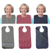 Three elderly women wearing adult waterproof mealtime bibs with adjustable necks and catch-all pockets.
