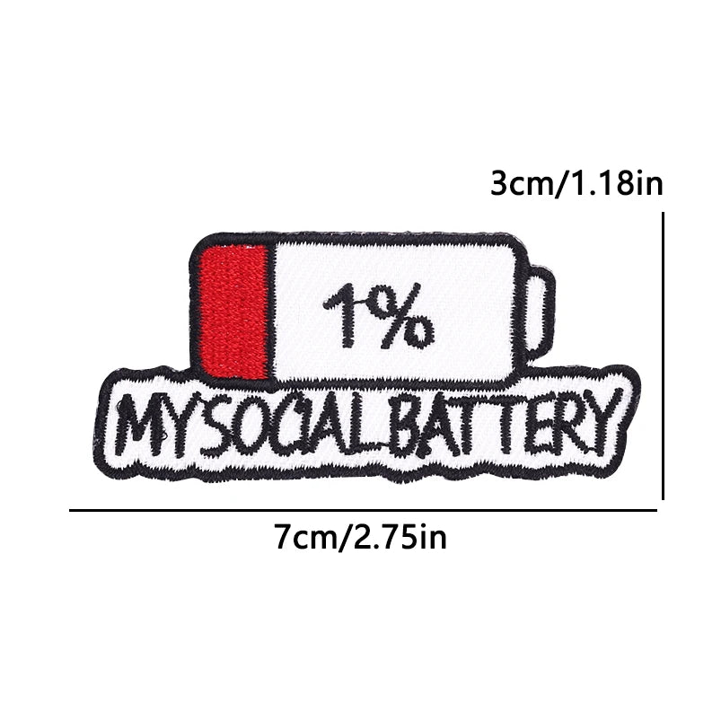 A white iron-on embroidery patch with a red tab labeled 1% and the text MYSOCIAL BATTERY.