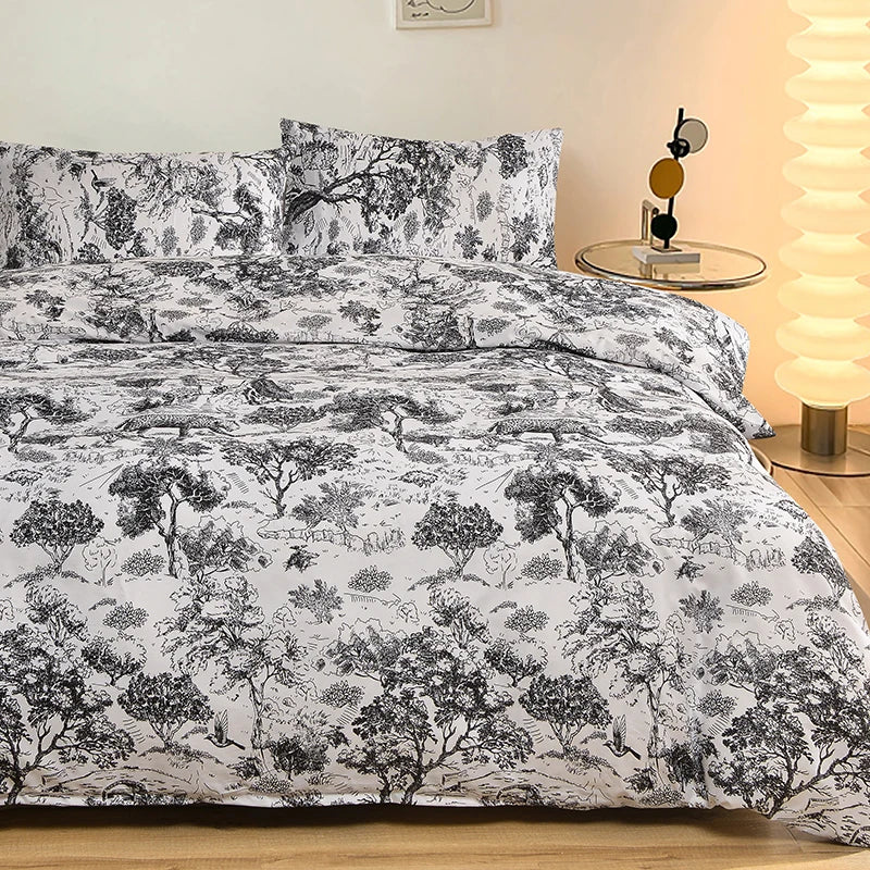 Black and white marble print duvet cover set with pillows displayed on a bed.