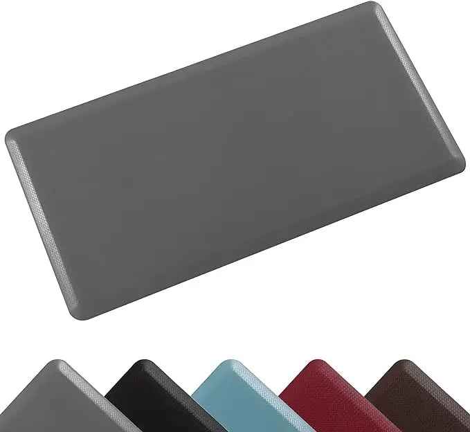 A gray anti-fatigue PVC kitchen mat shown from an angle.