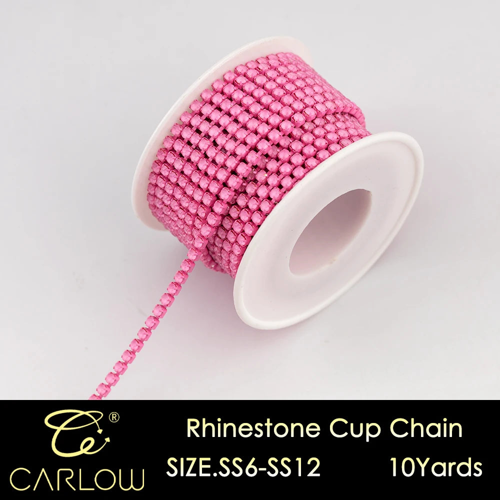 Pink rhinestone cup chain with a long string of beads and a white plastic cap