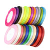 A collection of 6mm gold-edged satin ribbon in various colors, including pink, yellow, green, and purple.